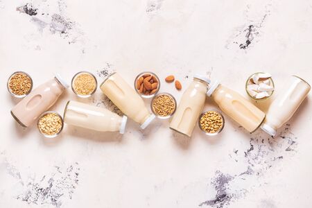 A bottles of alternative  milk and ingredients, top view.の写真素材