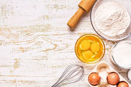 Bakery products -flour, eggs, milk. Top view, copy space.