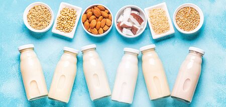 A bottles of alternative  milk and ingredients, top view.の写真素材