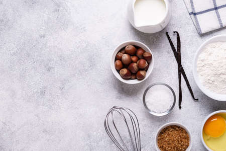 Ingredients for baking - flour, milk, salt, sugar, eggs. Top view, copy space.の写真素材