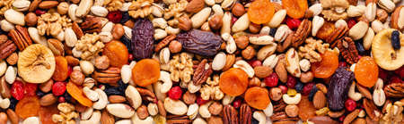 Background from various nuts and dried fruits, top view.の写真素材