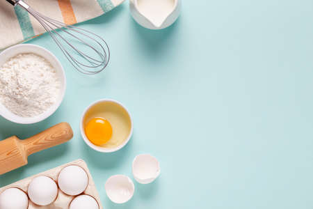 Baking or cooking background. Ingredients, kitchen items for baking. Top view.