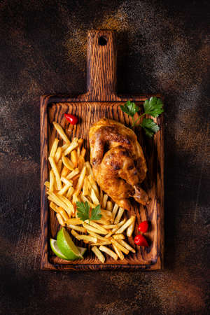 Half roasted chicken Piri Piri with french fries, top viewの写真素材