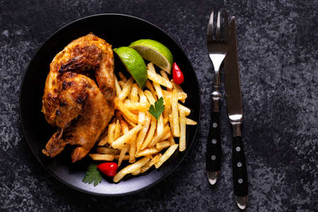 Half roasted chicken Piri Piri with french fries, top viewの素材 [FY310164000216]