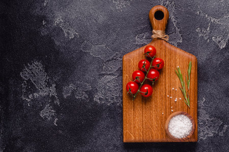 Herbs and condiments on black stone background. Top view with copy space.の写真素材