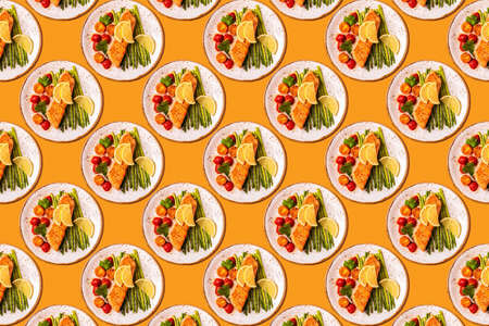 Pattern of grilled salmon with asparagus and tomatoes.の写真素材