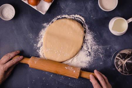 Table with baking products and tools. Culinary, baking concept.
