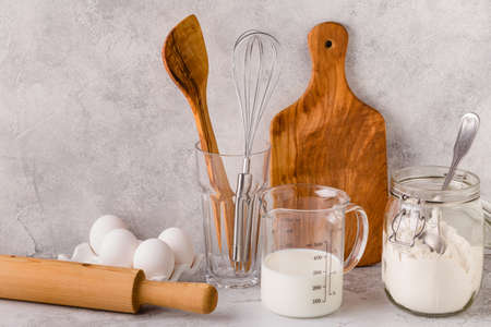 Bakery ingredients -flour, eggs, milk. Selective focus, copy space.