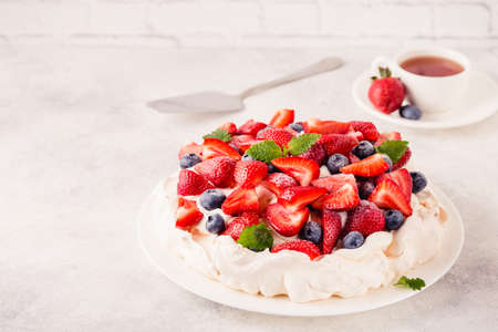 Delicious Pavlova cake with fresh strawberry and blueberry, selective focusの写真素材