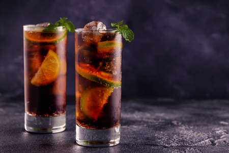 Rum and Cola cocktail Cuba Libre with lime and iceの写真素材
