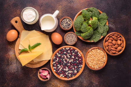 Products rich in calcium on dark background. Healthy food. Top viewの写真素材