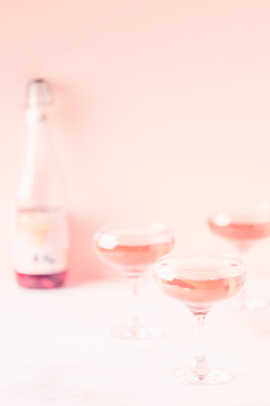 Champagne or wine in glasses on light background. Copy space.の写真素材