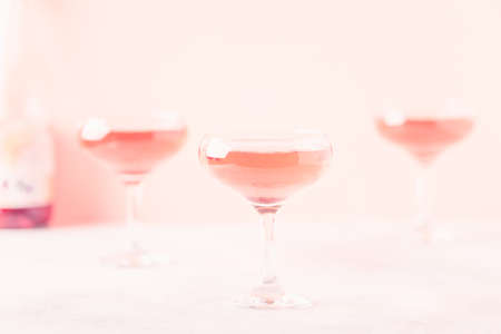Champagne or wine in glasses on light background. Copy space.の写真素材