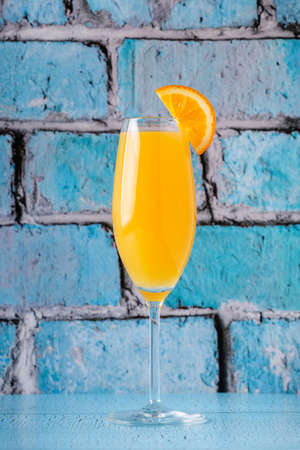 Refreshing orange Mimosa cocktails with champagne on a bright background.の写真素材