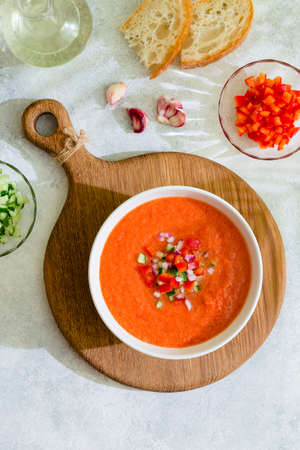 Gazpacho soup. Traditional spanish cold tomato soup of fresh raw vegetables, top view.の写真素材