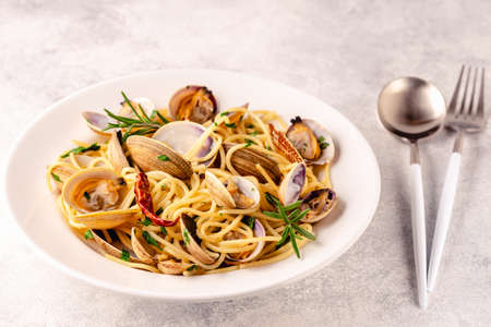 Seafood pasta with clams Spaghetti alle Vongole on a light background.の写真素材