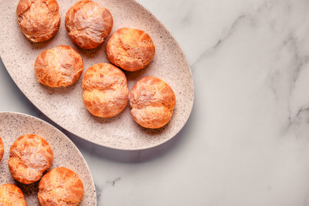 Homemade profiteroles with powdered sugar.の写真素材
