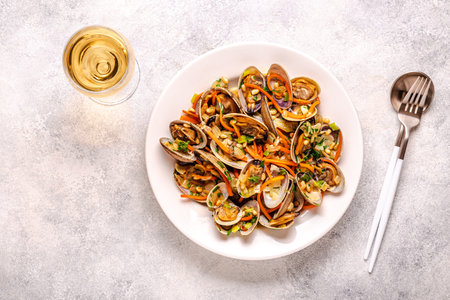 Shells vongole venus clams with vegetables and herbs.の写真素材