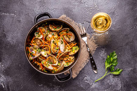 Shells vongole venus clams with vegetables and herbs.の写真素材