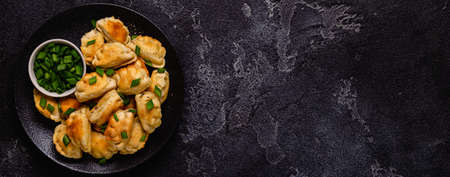 Dumplings, filled with mashed potatoes. Russian, Ukrainian or Polish dish: varenyky, vareniki,...