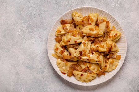Dumplings, filled with mashed potatoes. Russian, Ukrainian or Polish dish: varenyky, vareniki,...