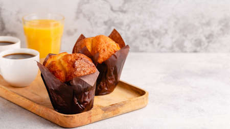 Hot coffee and muffin, selective focus.