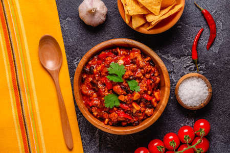 Chili Con Carne in bowl on dark background. mexican cuisine. top viewの写真素材
