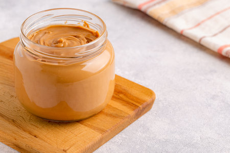 Peanut paste in an open jar