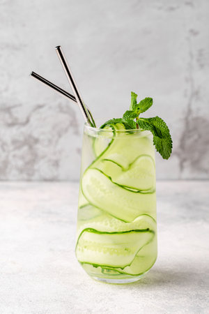 Fresh infused cucumber water on a light background, selective focusの写真素材