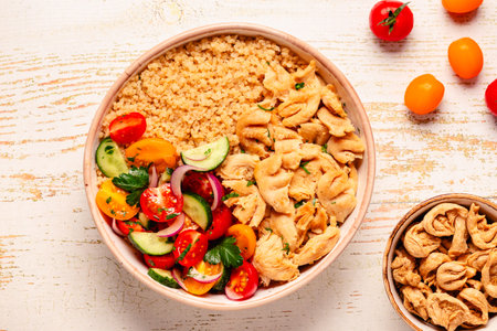 Bowl of quinoa with vegan soy meat and vegetables, top view.の写真素材