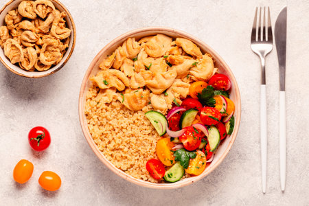 Bowl of quinoa with vegan soy meat and vegetables, top view.の写真素材