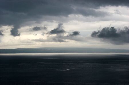 dark clouds on sea landscapeの写真素材