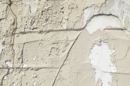 Close up of a white weathered stucco plaster wallの写真素材