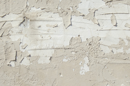 Close up of a white weathered stucco plaster wallの写真素材