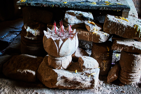 Historic building in Angkor wat Thom Cambodia with devatas carvings stone faces serenity milk oceanの写真素材