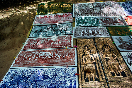 Historic building in Angkor wat Thom Cambodia with devatas carvings stone faces serenity milk oceanの写真素材