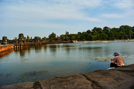 Angkor wat temple cambodia culture carvings stone sky waterの写真素材