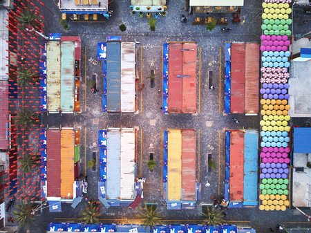 Aerial view at dawn sunset from drone bird eye eagle Angkor container night market in Siem-REap, Cambodia party with coloufull umbrellas and a lot opf texturesのeditorial素材