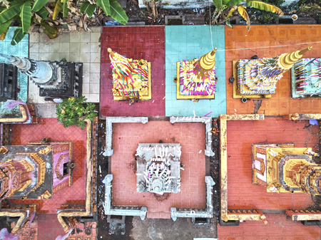 Aerial drone view topdown eagle eye of a traditionnal temple pagoda cemetery in siem reap cambodia...