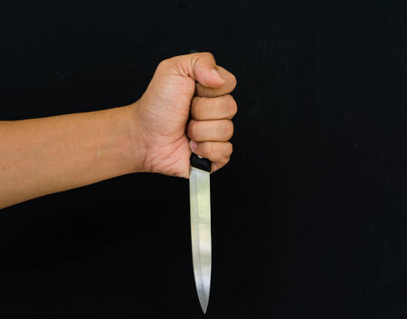 hand and knife meaning to violenceの写真素材