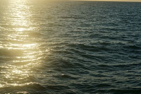 Sunlight reflecting off the ocean waterの写真素材