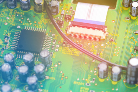 Closeup electronic circuit board background.