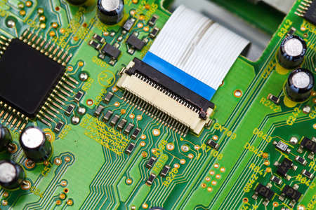 Closeup electronic circuit board background.