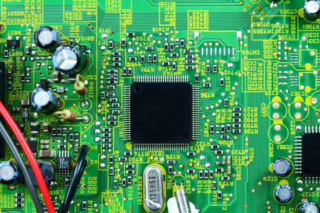 Closeup electronic circuit board background.