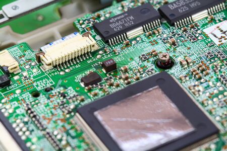 Closeup electronic circuit board background.