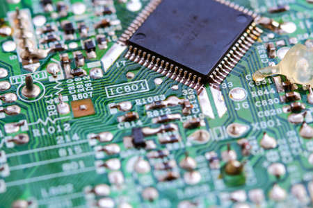 Closeup electronic circuit board background.
