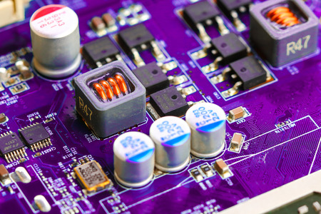 Closeup electronic circuit board background.