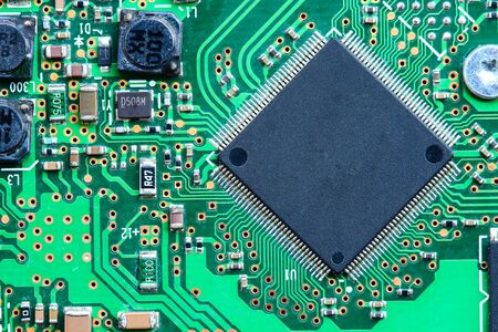 Closeup electronic circuit board background.