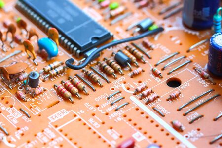 Closeup electronic circuit board background.