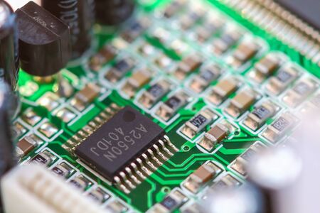 Closeup electronic circuit board background.